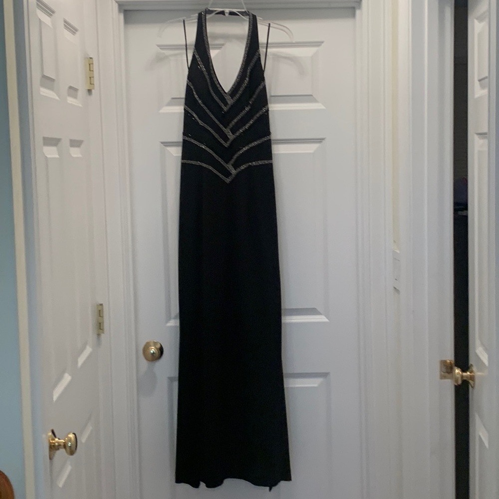 Black, halter, beaded Cache gown.